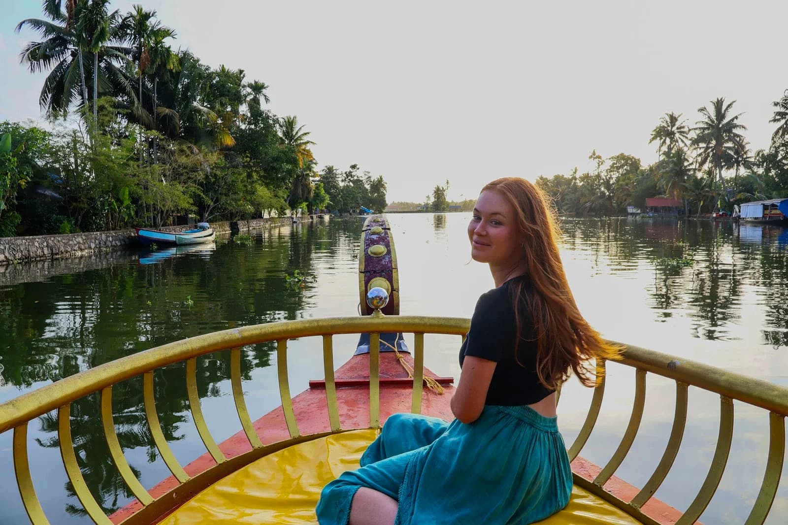 Shikara boat cruising through the Alleppey backwaters on Punnamada Lake